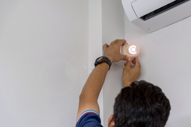 technicians are installing cctv camera wall 47469 384
